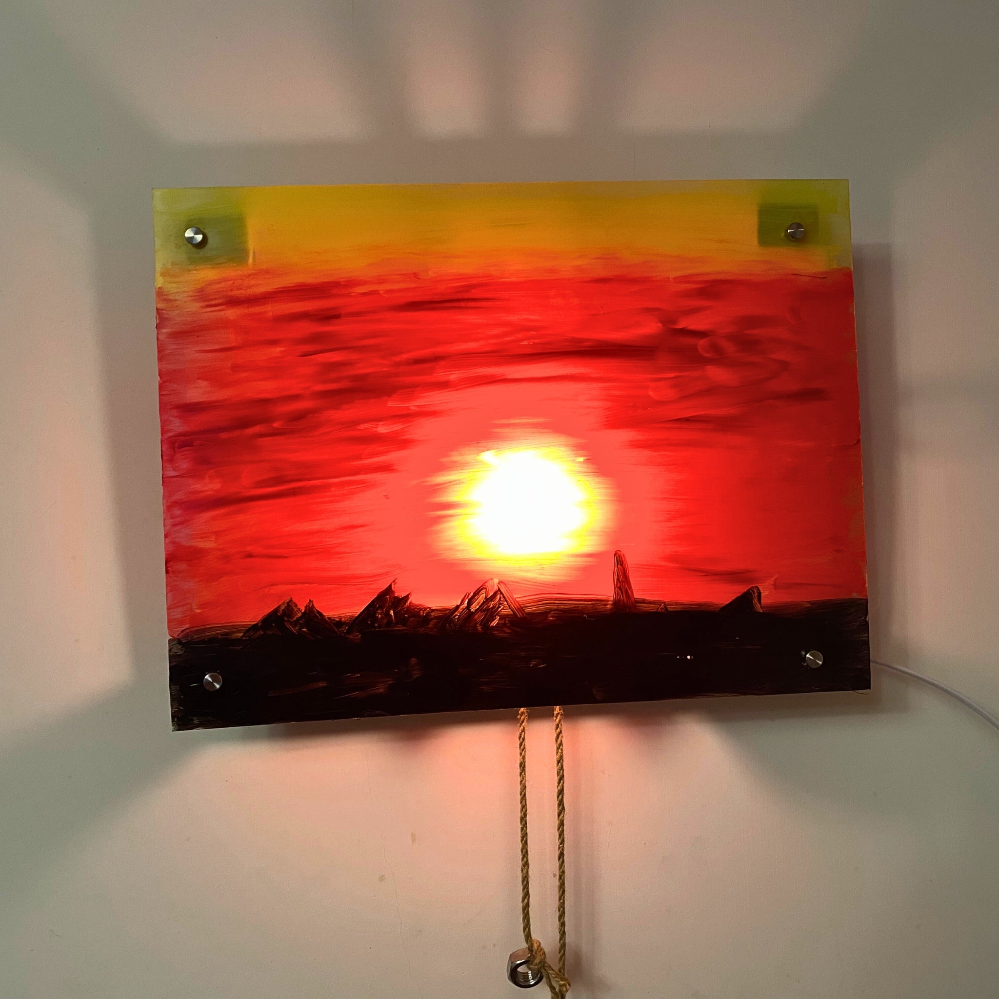Sunset kinetic wall art in a modern living room