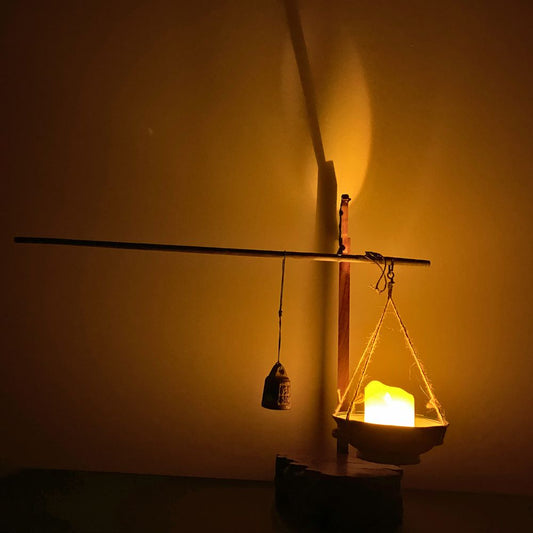 Chronometer of Light illuminated on a wooden desk, warm glow highlighting the beam and bowl